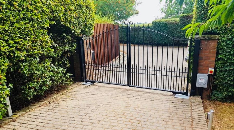 black gate on brown brick